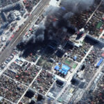 Maxar satellite imagery of burning buildings in Irpin, Ukraine on March 21, 2022. [Photo: Satellite image 2022 Maxar Technologies]