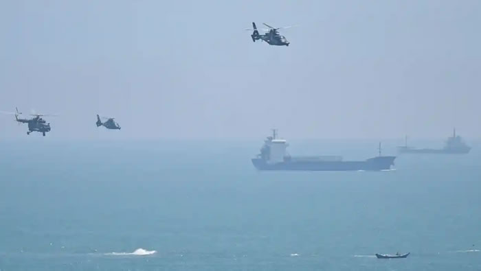 Chinese helicopters fly off Fujian province ahead of military drills around Taiwan in August. The Biden administration has announced a $1.1bn arms sale to Taiwan including missiles and air defence systems. Photograph: Héctor Retamal/AFP/Getty Images