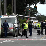 Police officers cordon off an area near the site of a shooting in Central Auckland, on July 20, 2023