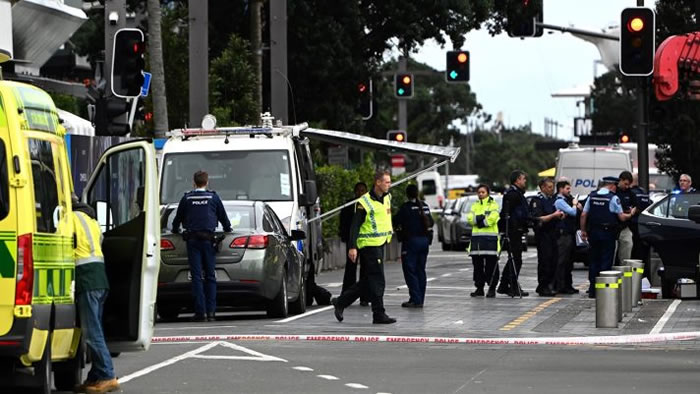 Police officers cordon off an area near the site of a shooting in Central Auckland, on July 20, 2023