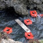 Flotation devices are seen in the area where a migrant boat capsized off the Italian coast, on the island of Lampedusa, Italy. /Mauro Buccarello/File Photo/Reuters