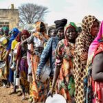 Famine-stricken Sudan camp faces influx of displaced people amid flood risks