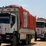 aid trucks cross into Sudan from Chad